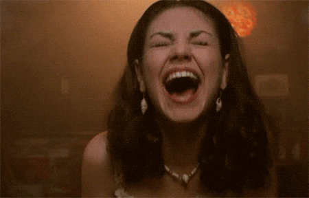 Mila-Kunis-As-Jackie-Burkhart-Laughing-Hysterically-In-The-Circle-On-That-70s-Show.gif