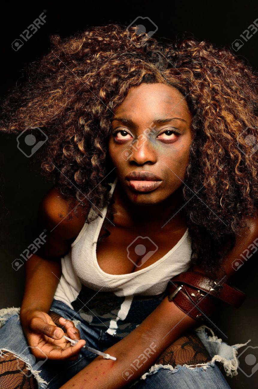 20638221-A-young-beautiful-african-american-female-poses-as-a-track-whore-shooting-up-narcotics-in-this-dark--Stock-Photo.jpg