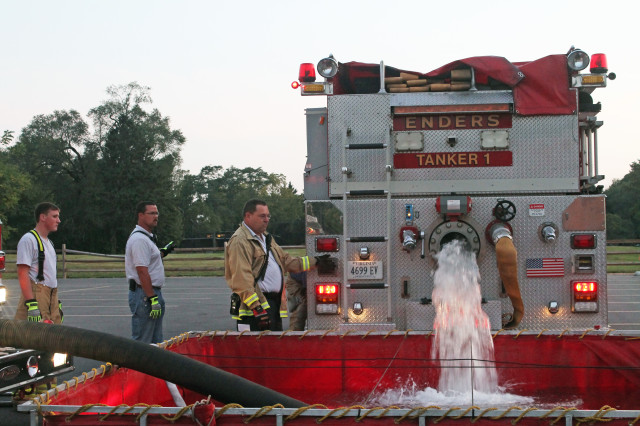 Chief-Rhohde-with-firetruck-water-640x426.jpg