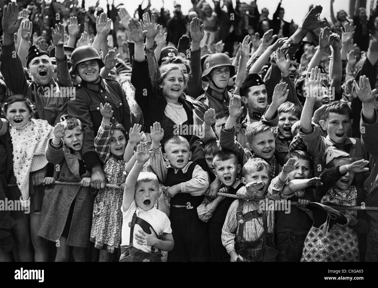 german-children-and-soldiers-give-the-nazi-salute-during-parade-CXGA65.jpg
