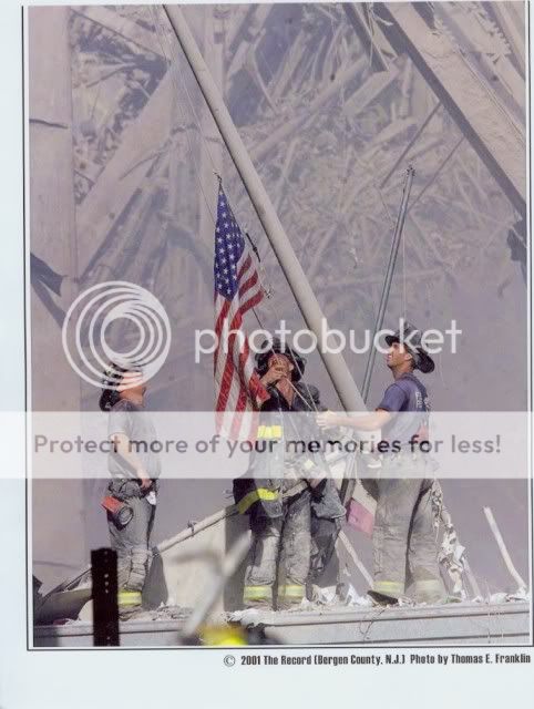 9-11_firemen_raising_the_flag_at_gr.jpg