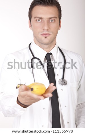 stock-photo-portrait-of-a-young-attractive-male-doctor-offering-banana-111555998.jpg
