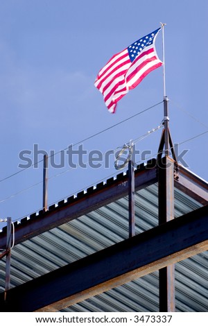 stock-photo-a-united-states-flag-raised-by-iron-workers-atop-the-structure-they-are-building-3473337.jpg