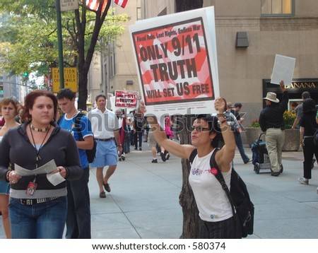 stock-photo-an-angry-protester-shouts-to-passersby-to-open-their-eyes-to-the-truth-about-580374.jpg