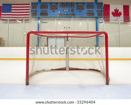 stock-photo-ice-hockey-empty-net-with-scoreboard-in-the-background-33296404.jpg
