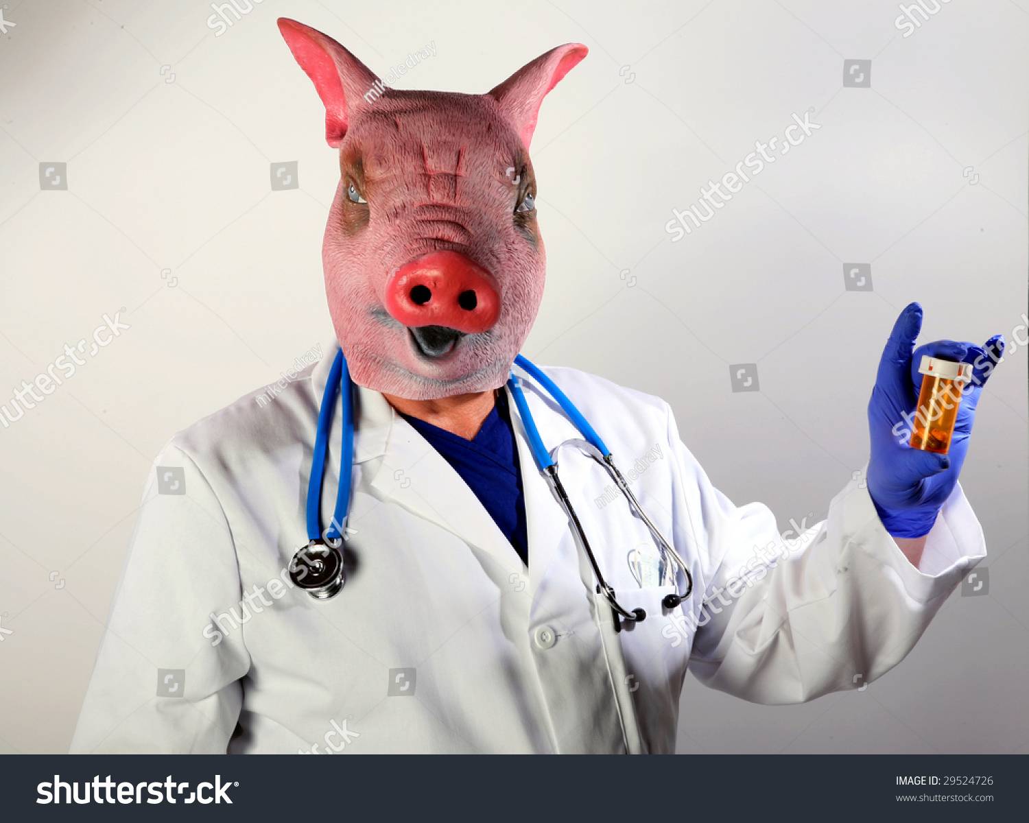 stock-photo-a-doctor-in-a-pig-mask-holds-a-bottle-of-pills-representing-the-mexican-swine-flu-pandemic-29524726.jpg