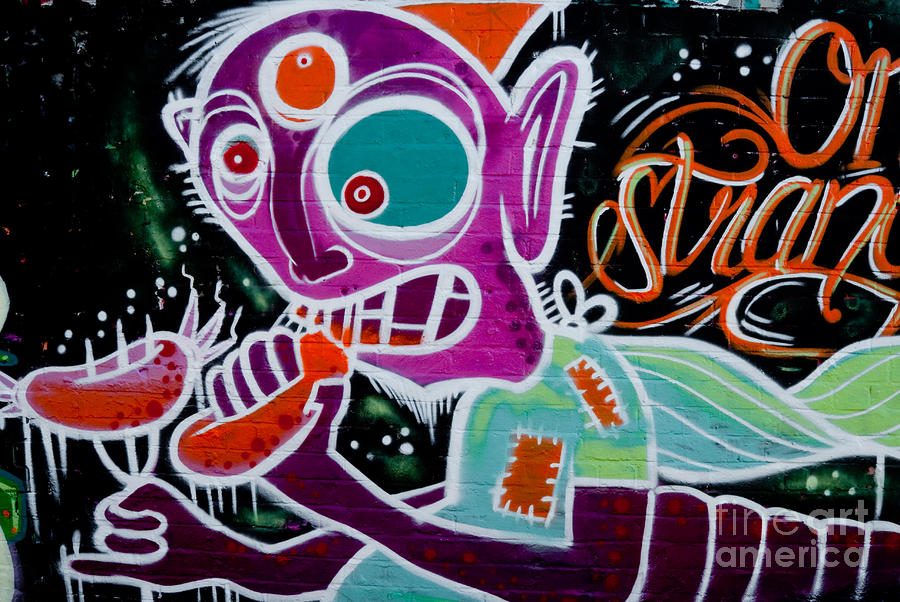 strange-graffiti-creature-eating-sausages-yurix-sardinelly.jpg