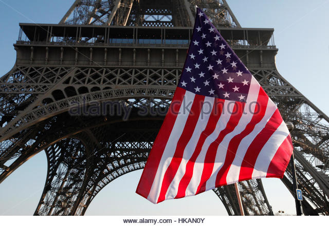 an-american-flag-is-seen-during-a-womens-march-near-the-eiffel-tower-hkan0y.jpg