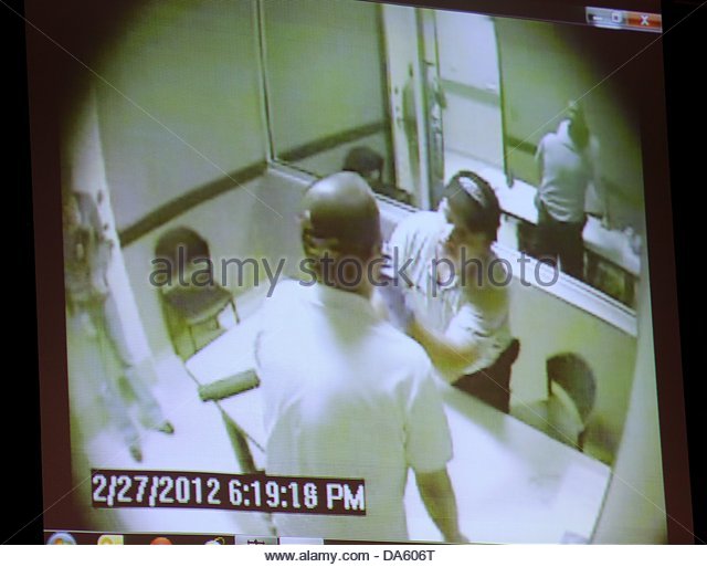 epa03770463-a-video-of-george-zimmerman-giving-a-dna-sample-at-the-da606t.jpg