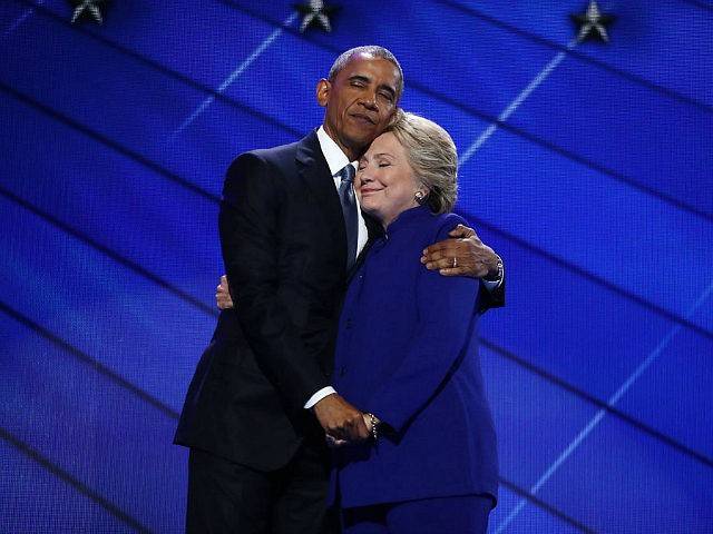 obama-hillary-clinton-smile-hug-hold-hands-getty-640x480.jpg