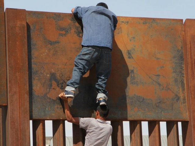 illegals-climb-border-wall-getty-640x480.jpg
