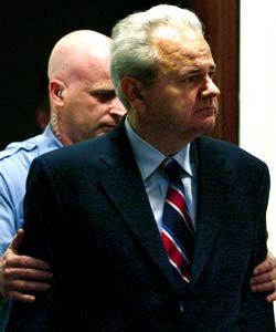 Slobodan-Milosevic-Escorted-by-Police-at-ICTY.jpg