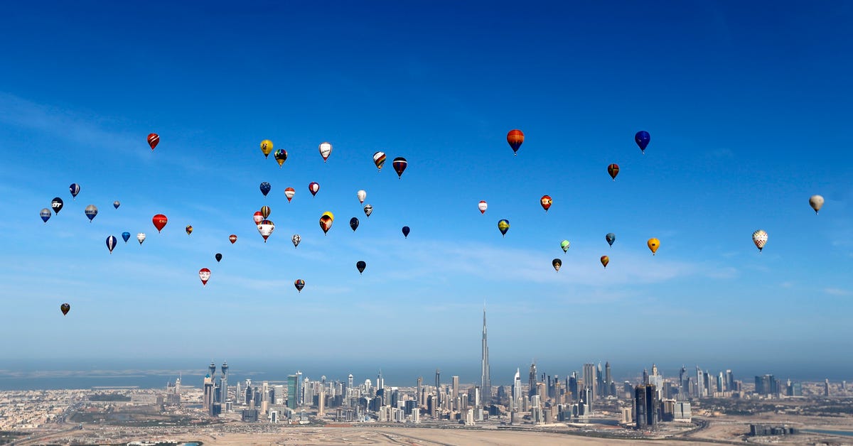 hot-air-balloons-fly-over-dubai-during-the-world-air-games-2015-held-under-the-rules-of-the-federation-aeronautique-internationale-fai-as-part-of-the-dubai-international-balloon-fiesta-event-united-arab-emirates-december-9-2015.jpg