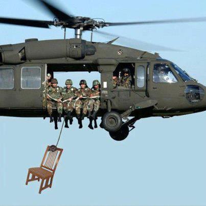 Marines-in-helicopter-with-chair.jpg