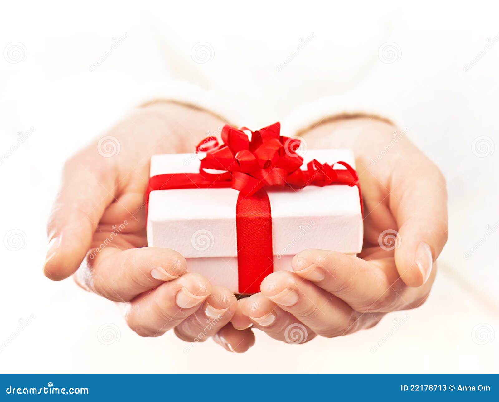 hands-holding-beautiful-gift-box-22178713.jpg