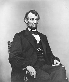240px-Abraham_Lincoln_seated%2C_Feb_9%2C_1864.jpg