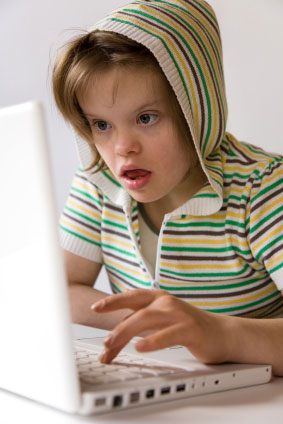 girl-child-with-downs-syndrome-on-laptop.jpg