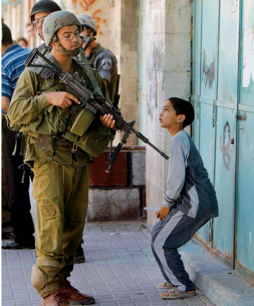 israel-soldier-gun-child.gif