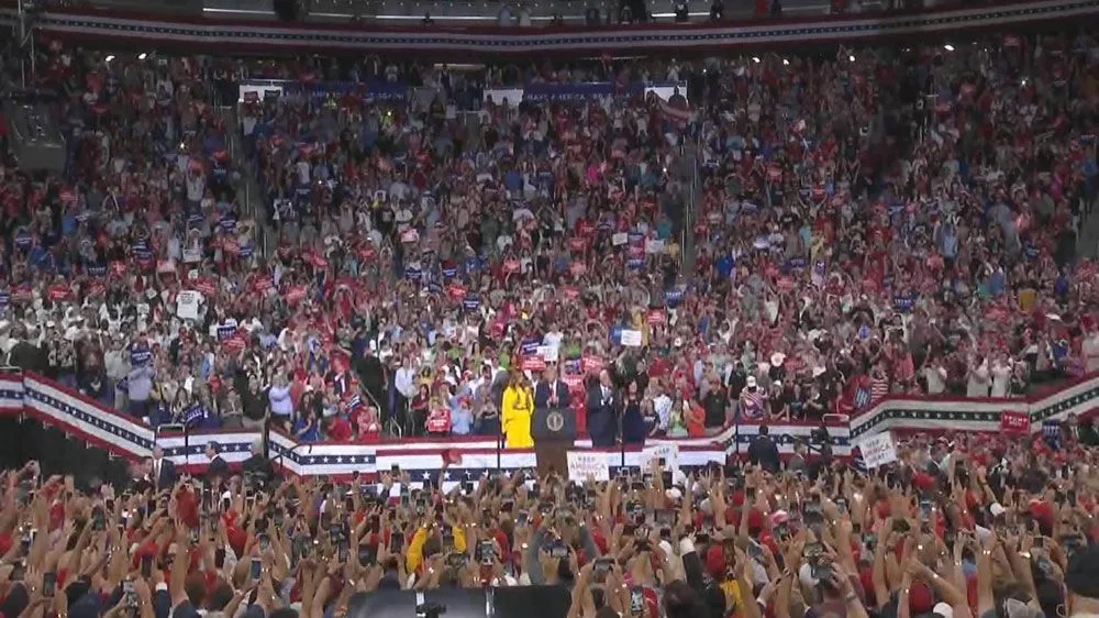 061819_N13-TRUMP-RALLY-WALK-ON-CROWD.webp