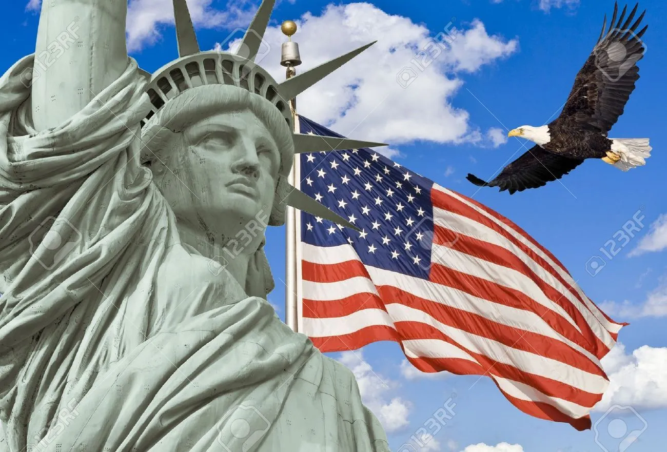 15018775-American-Flag-flying-bald-Eagle-statue-of-liberty--Stock-Photo.webp