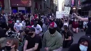 Protesters take a knee in silence in Times Square | The Advertiser