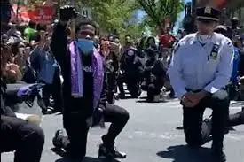 NYPD cops take a knee beside protesters in moment of solidarity ...