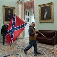 january 6 2021 democrat carrying confederate flag from www.cnbc.com
