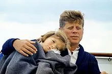 220px-JFK_with_Caroline_on_the_Honey_Fitz,_1963.webp