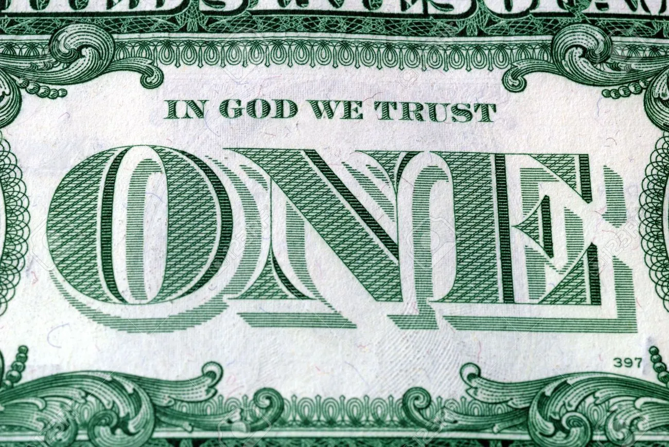 3420887-in-god-we-trust-motto-s-on-the-reverse-of-a-us-dollar-bill.webp
