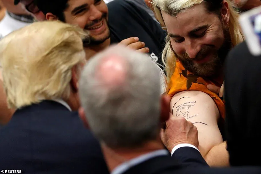 37725434-0-Donald_Trump_signs_the_tattooed_arm_of_Tim_Gionet_an_online_pers-a-13_1610052277241.webp