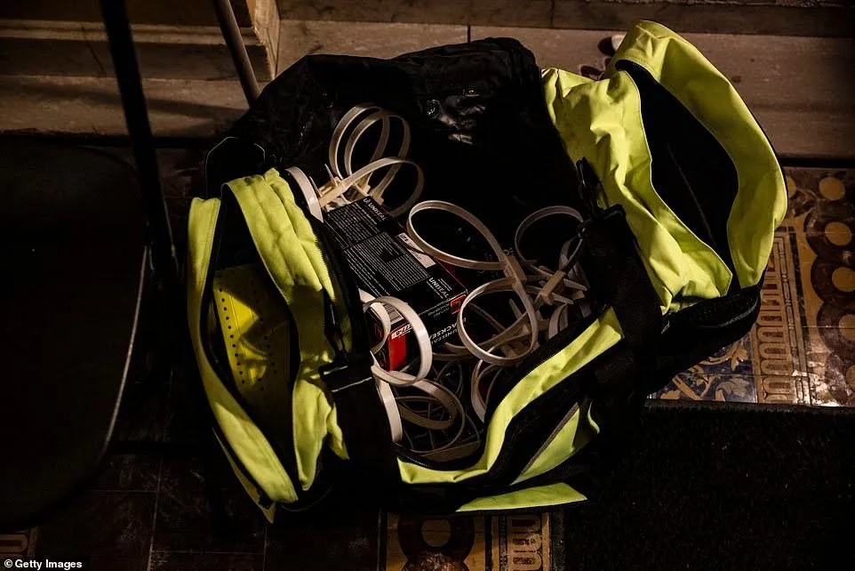 37734852-9122541-A_duffle_bag_of_flex_cuffs_remains_at_the_northern_entrance_door-a-81_161004...webp