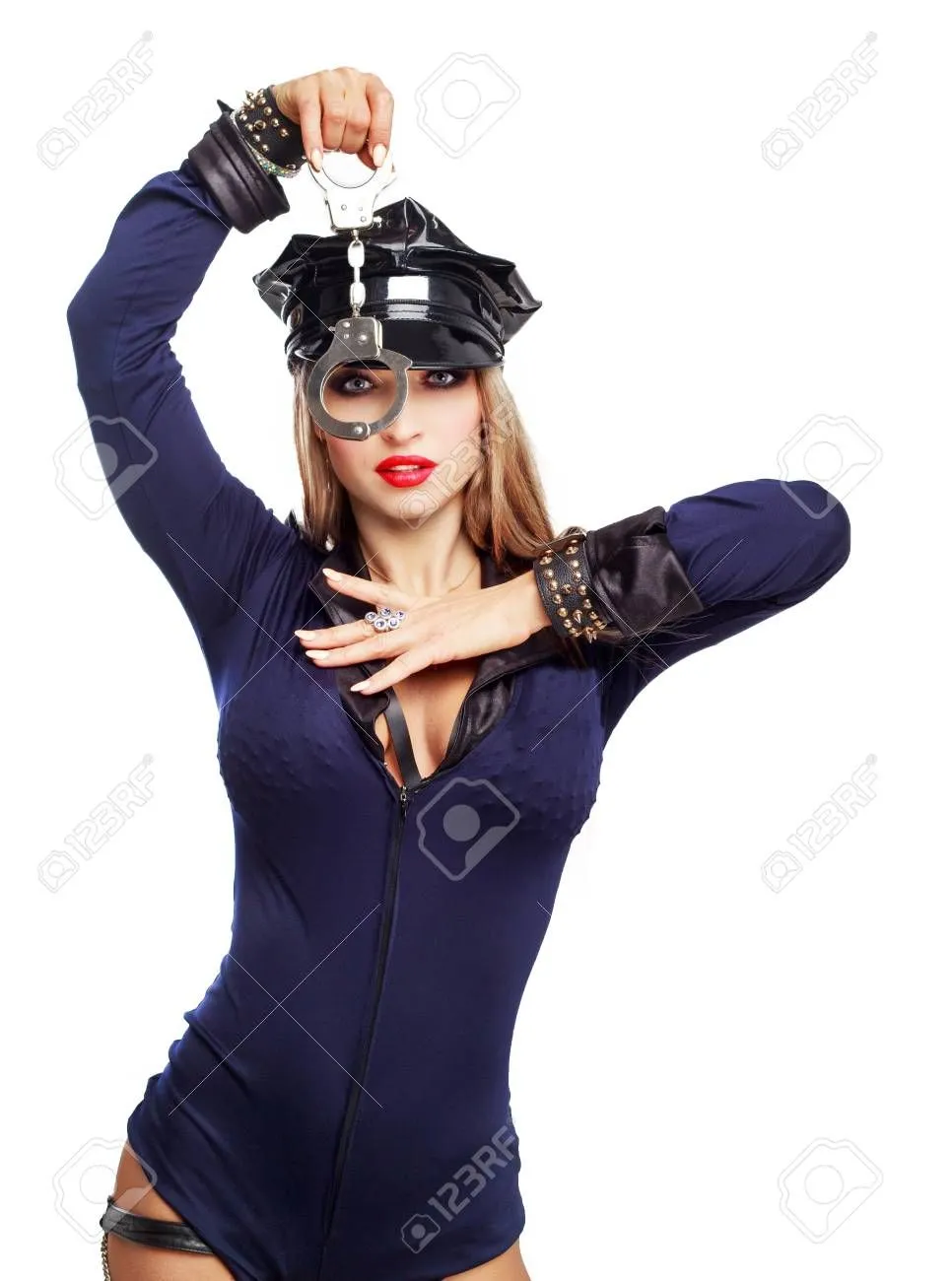 87016656-beautiful-striptease-dancer-dressed-as-a-police-officer-with-handcuffs-isolated-agai...webp