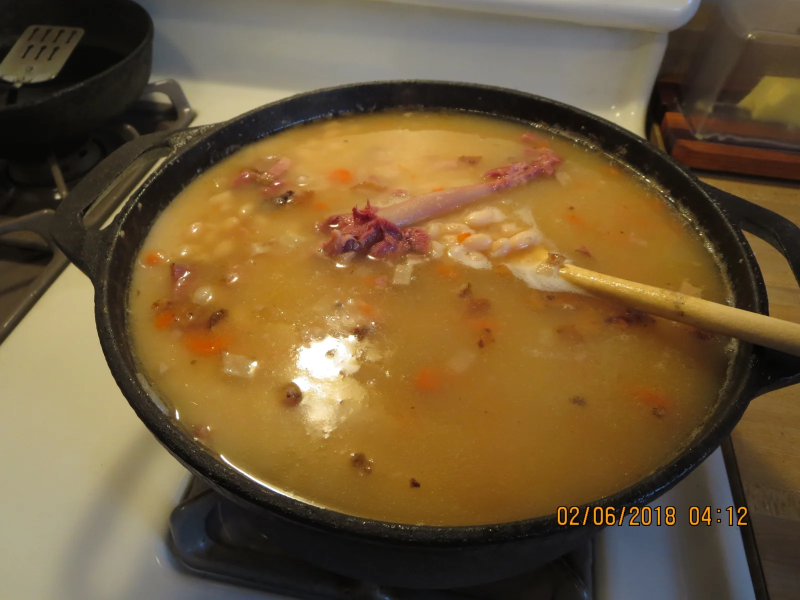 Bean soup cooking.webp
