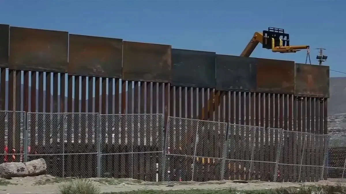border+wall+construction.webp