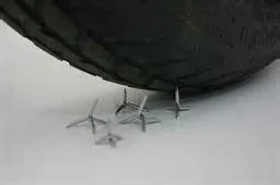 caltrop vs tire.webp