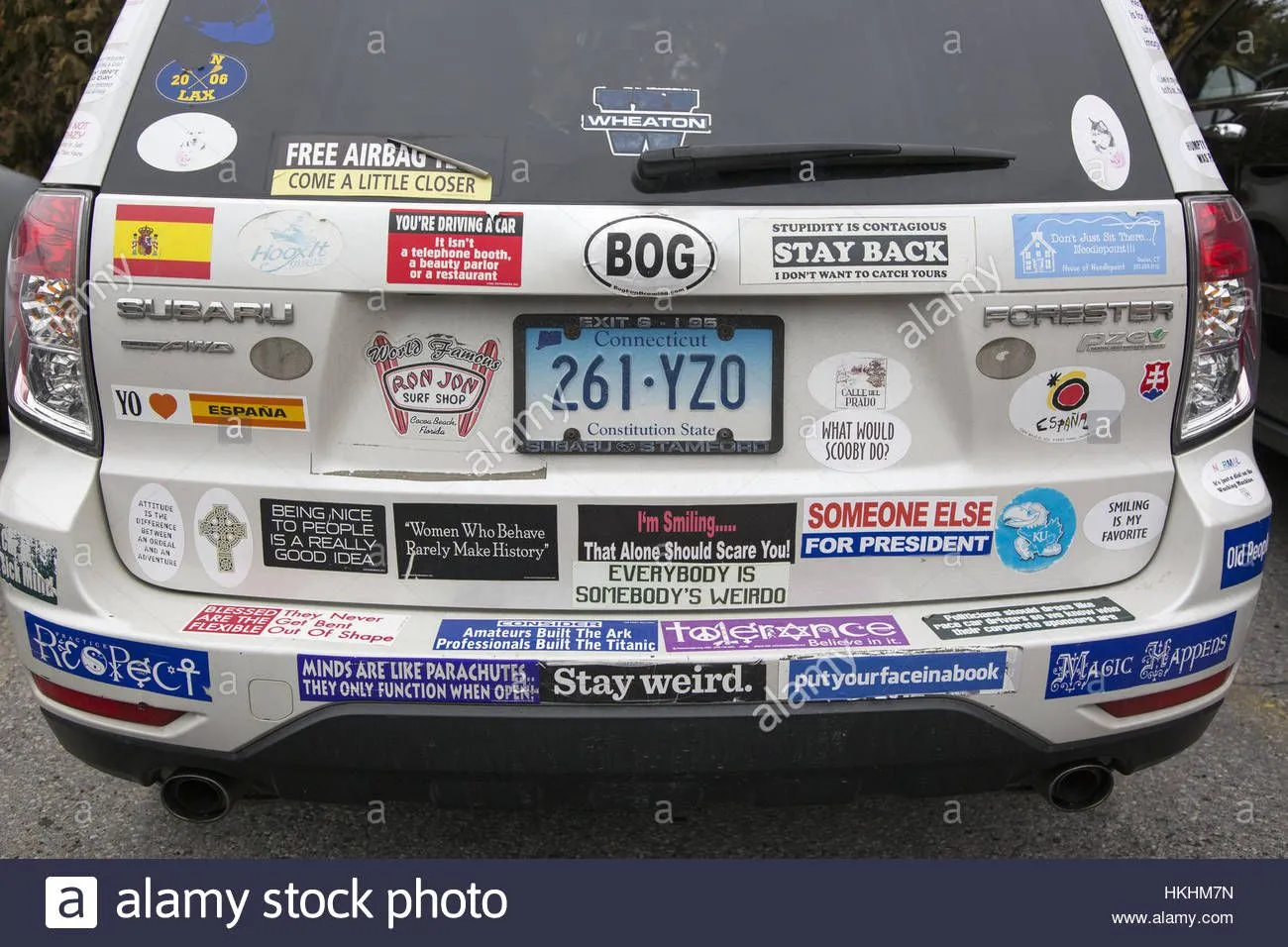 car-covered-with-interesting-irreverent-bumper-stickers-HKHM7N.webp