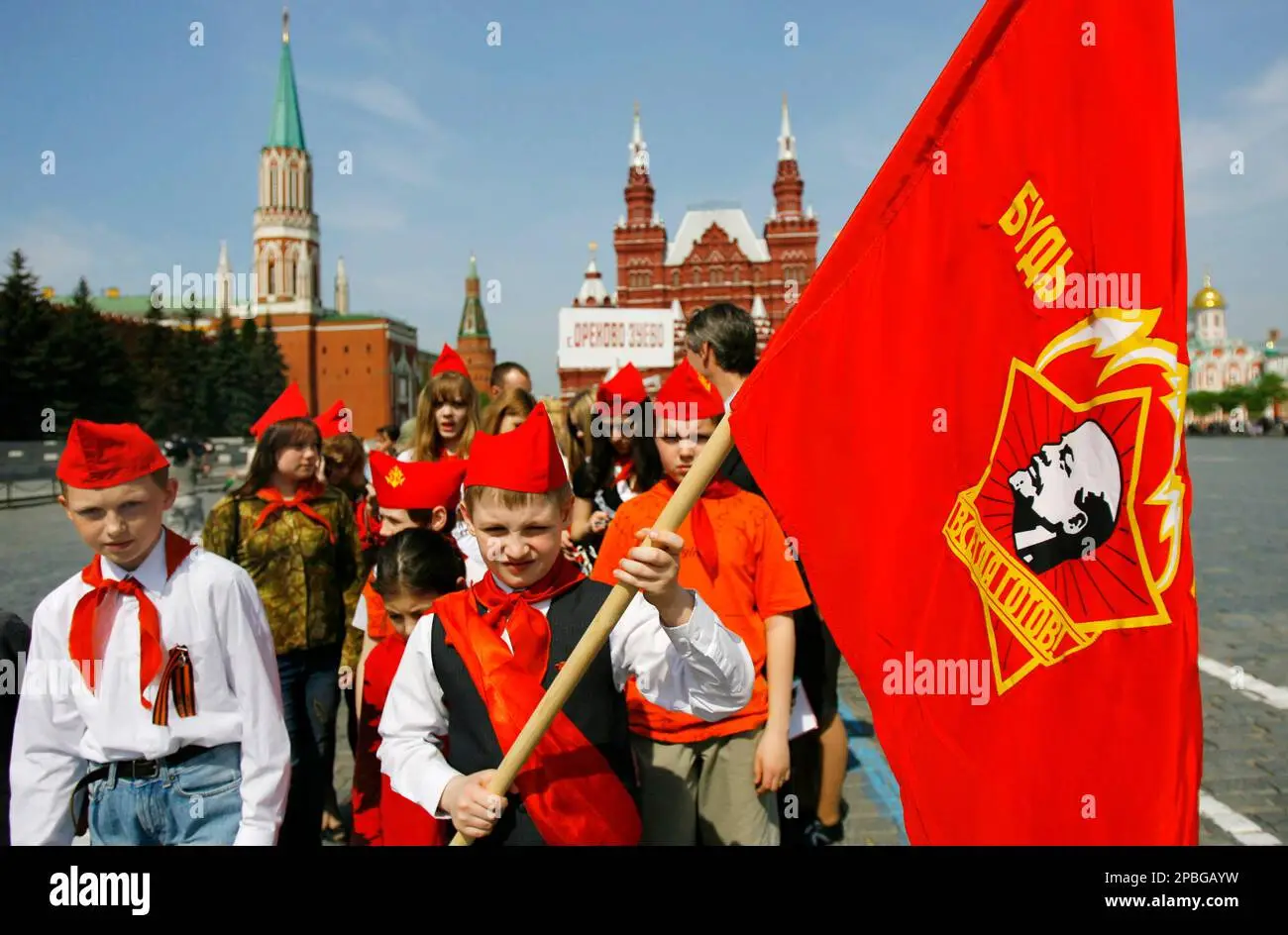 children-wearing-red-ties-a-symbol-of-the-young-pioneers-march-along-red-square-after-a-cerem...webp