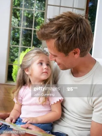 daughter-sitting-on-fathers-lap-face-to-face-closeup-picture-id200498652-003.jpg