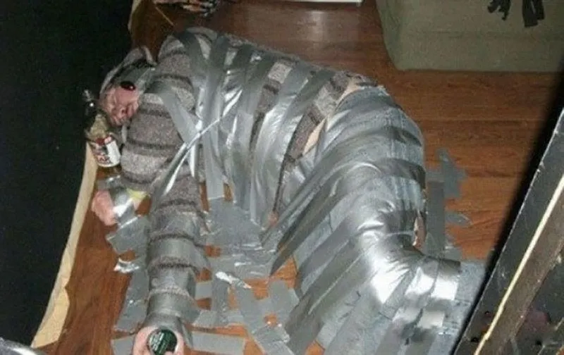 Duct-Tape-Man-Funny-Passed-Out-Picture.webp