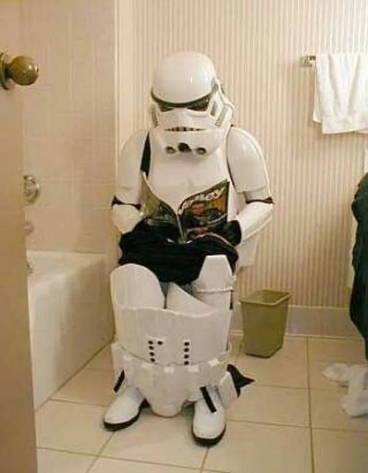 Funny-Robot-On-Toilet-Seat-Reading-Magazine.webp