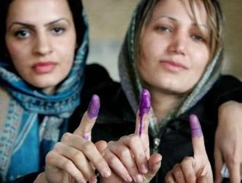 history_timeline_photo_15_2-Women_display_their_purple_fingers_after_voting.webp
