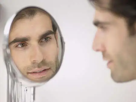 man-looking-in-mirror.webp