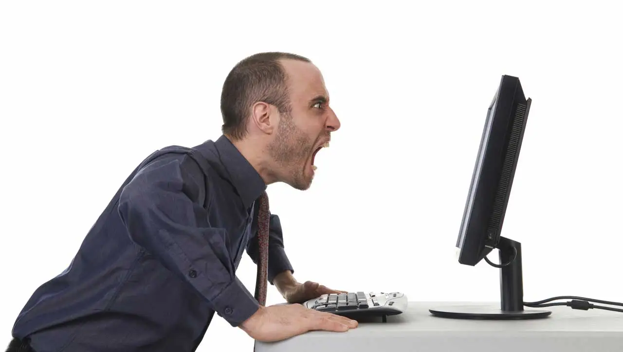 Man-shouting-at-computer.webp