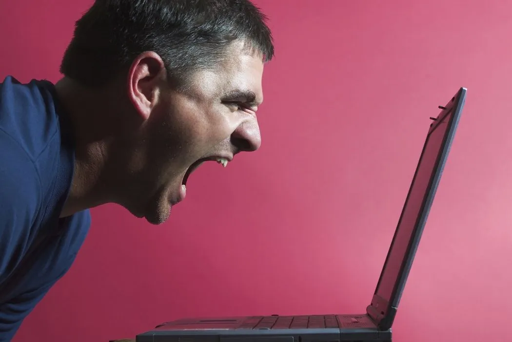 man_yelling_at_computer.webp