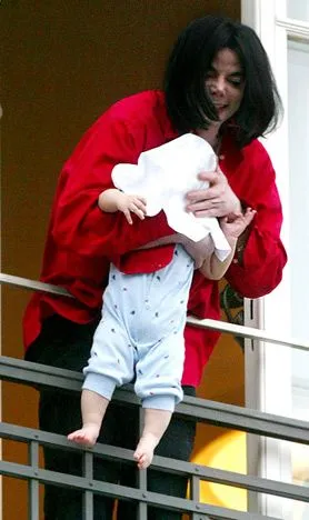michael-jackson-dangles-baby-from-a-balcony.webp