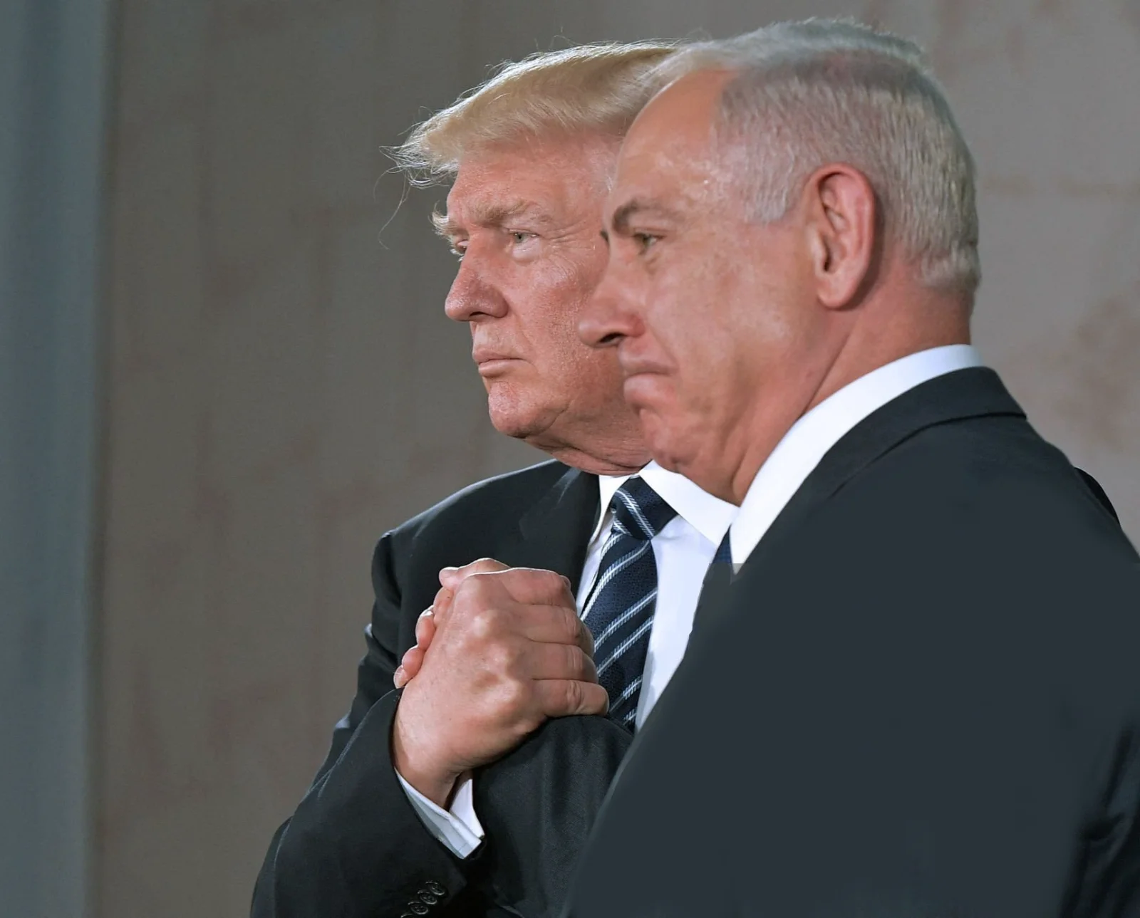 Netnanyahu Trump holding hands.webp