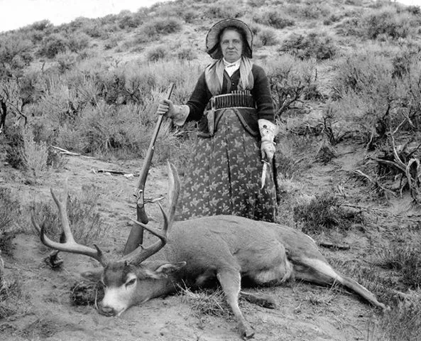 Pioneer-Woman-with-Gun-and-Mule-Deer.webp