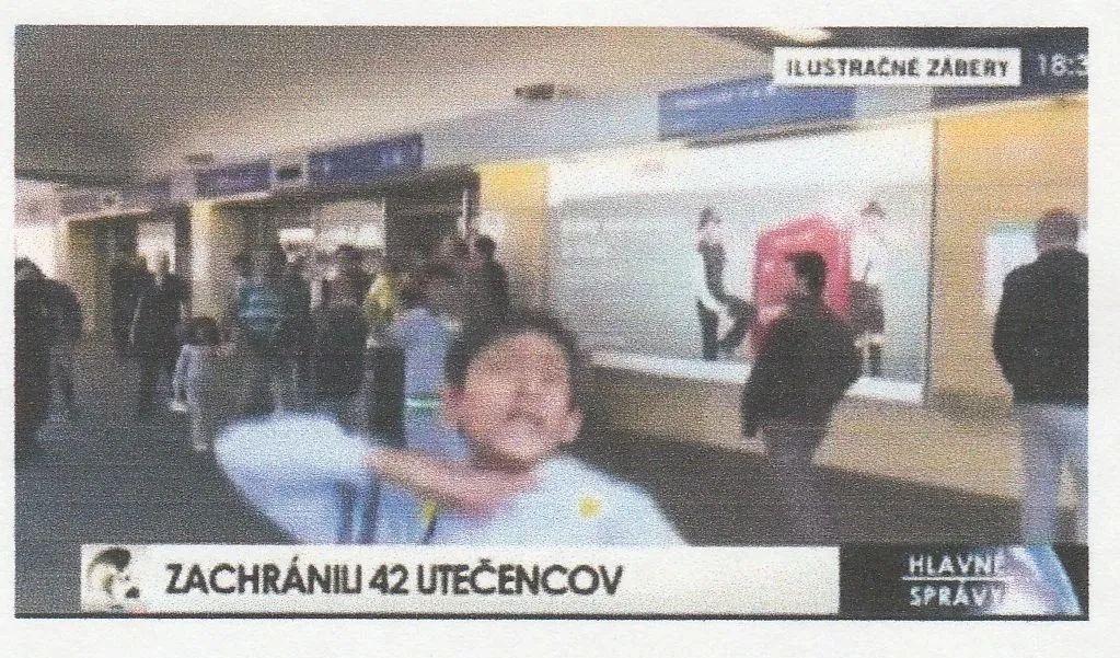 sand negro immigrant child gives beheading gesture to TV cameras.webp