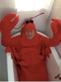 sir-patrick-stewart-dressed-as-a-lobster-and-lounging-in-a-tub-139697.webp