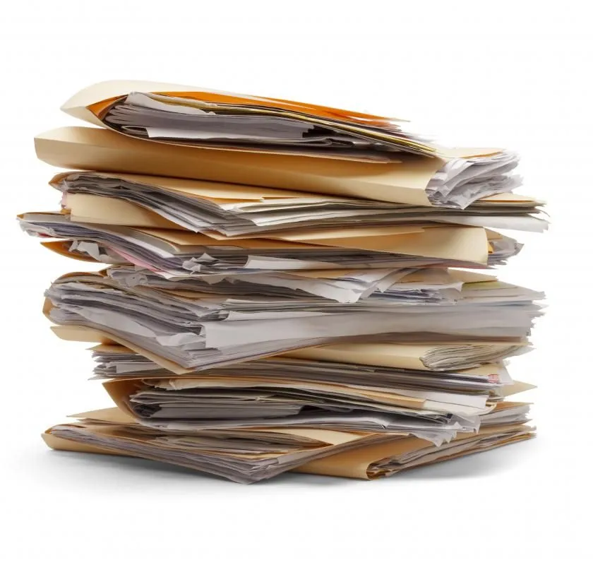 stack-of-folder-stuffed-full.webp